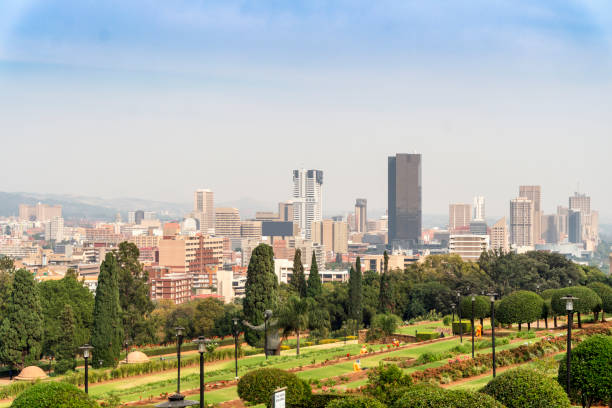 Garden and Pretoria downtown taken from Union Buildings, South Africa Union Buildings Park and Pretoria downtown, South Africa union buildings stock pictures, royalty-free photos & images