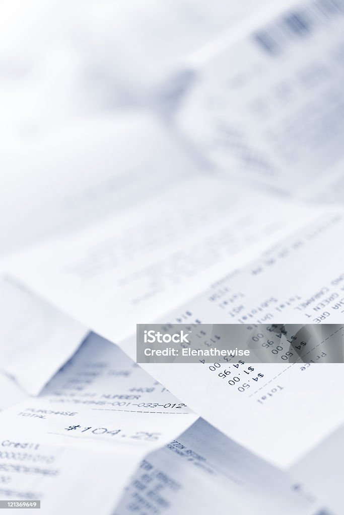 Blur picture of some sales receipts Paper cash register receipts in a lose pile close up Balance Stock Photo