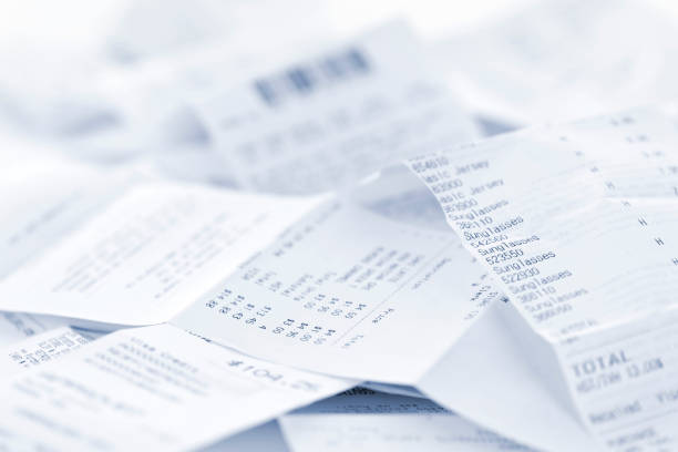 Sales receipts Paper cash register receipts in a lose pile close up receipt photos stock pictures, royalty-free photos & images