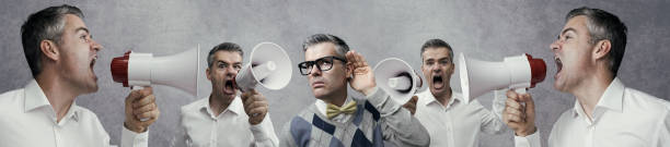 istock Man listening to a loud noise 1213697262