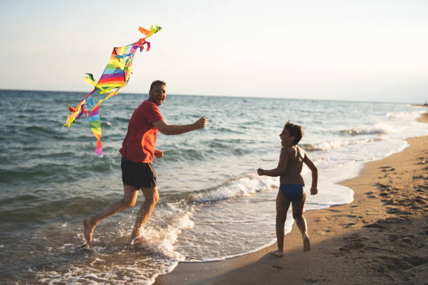 istock Father and son flying a kite 1213698766