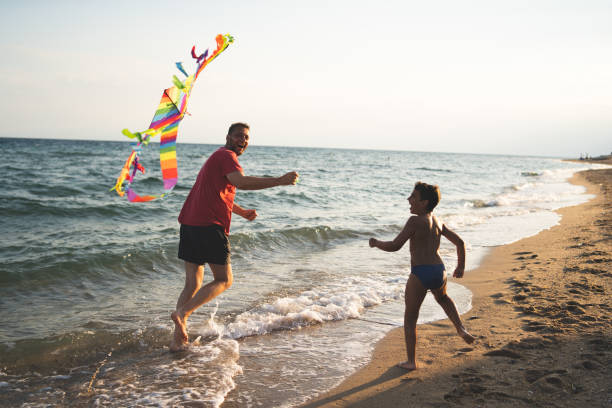 istock Father and son flying a kite 1213698790