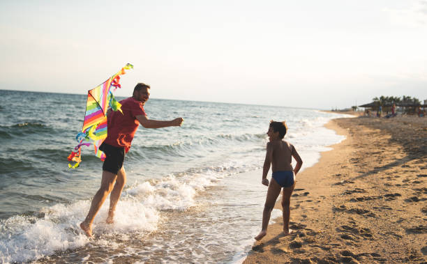 istock Father and son flying a kite 1213698964