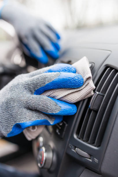 istock Auto service staff hand cleaning car interior with microfiber cloth. Car detailing and valeting concept 1213699602