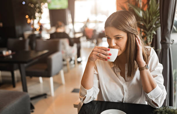 istock Woman in coffee shop 1213699998