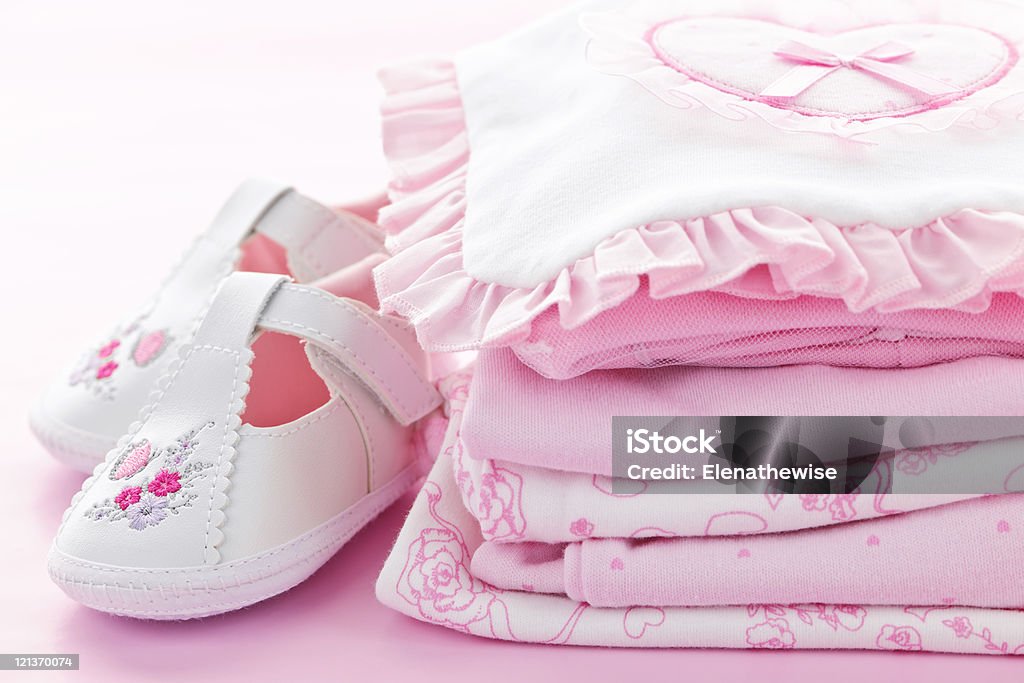 Pink baby clothes for infant girl  Baby - Human Age Stock Photo
