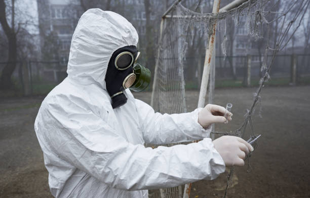 istock Scientist collecting samples for laboratory test on the street. 1213701369