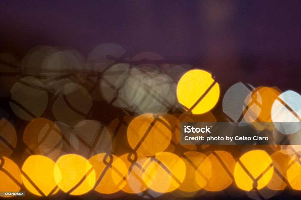 abstract lights and wires abstract image of circular lights with wire mesh silhouettes Abstract Stock Photo