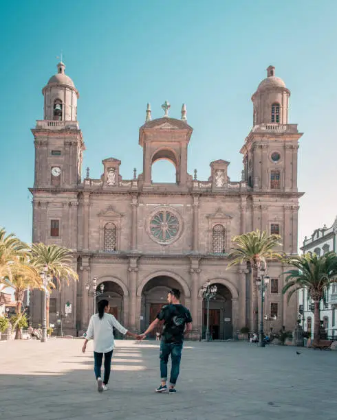 Gran Canaria December 2018, Cathedral of Santa Ana Las Palmas Gran Canarica, couple men and woman walking by Cathedral of Santa Ana during vacation Gran Canaria Spain
