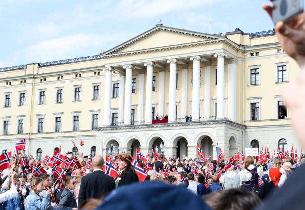 17 May Photo taken during the Norwegian National Day on the 17 of May in Oslo.
The photo is the end of the parade in front of the castle.
Many people are holding the Norwegian flag, kids are singing wile the king and queen are on the balcony looking at al the people 
gathered in front of them. number 17 stock pictures, royalty-free photos & images