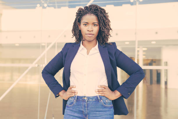 istock Serious successful female manager posing near office 1213708120