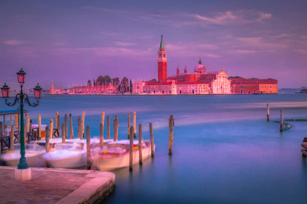 Long exposure: ethereal San Giorgio Maggiore cathedral at sunset - Venice, Italy Long exposure: blurred ethereal San Giorgio Maggiore cathedral at sunset - Venice, Italy venice italy grand canal honeymoon gondola stock pictures, royalty-free photos & images