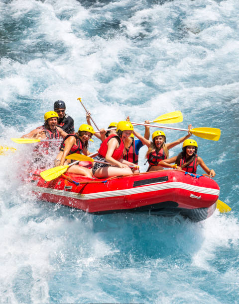 istock Group of people white water rafting 1213711155