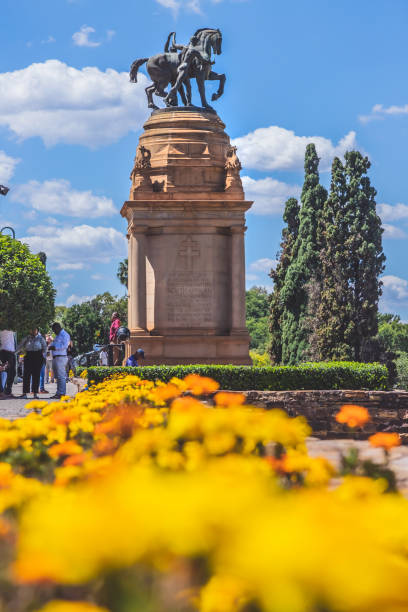 Gardens surrounding Union buildings in Pretoria Pretoria, South Africa, 15th March - 2020: Flowers and statue at the Union buildings in Pretoria union buildings stock pictures, royalty-free photos & images
