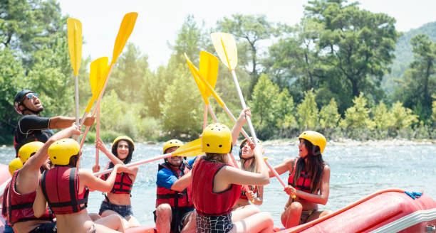 istock Group of people white water rafting 1213712082