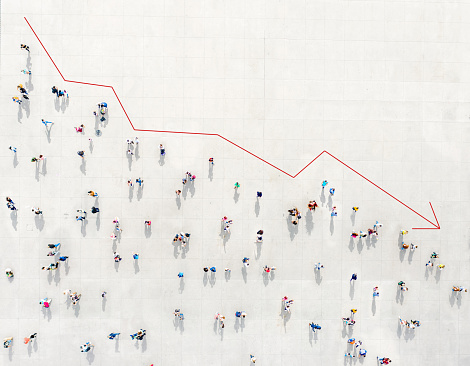 Crowd from above forming a falling chart showing unemployment