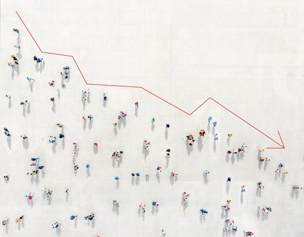 Crowd from above forming a falling chart Crowd from above forming a falling chart showing unemployment moving down stock pictures, royalty-free photos & images