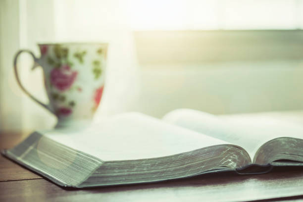 istock The holy bible and a cup of coffee on table 1213713695