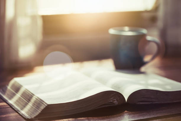 istock The holy bible and a cup of coffee on table 1213713700