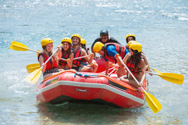 istock Group of people white water rafting 1213713749