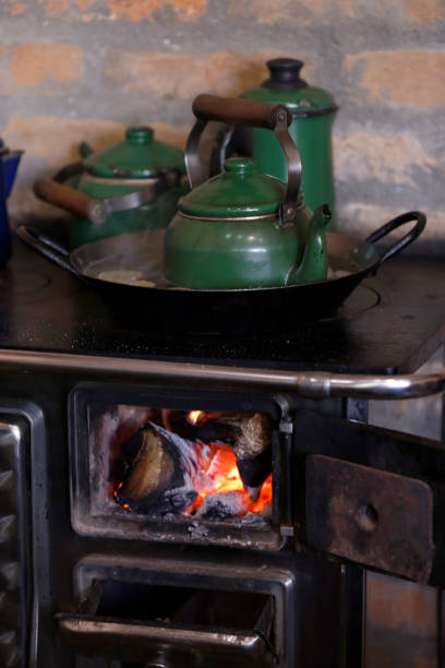 istock coffee kettle in wood burning stove 1213714327
