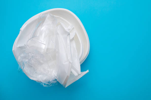 istock plastic dish and plastic cup on  blue paper background 1213716039