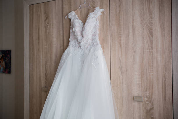 istock wedding dress hanging on the closet 1213718027