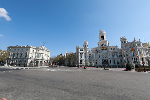 This picture was taken at The Plaza de Cibeles where is sited the Town Hall of Madrid. On a usual saturday the square is full of tourist and people around, while now on March 14th It is absolutely empty due to the lockdown for coronavirus in Madrid