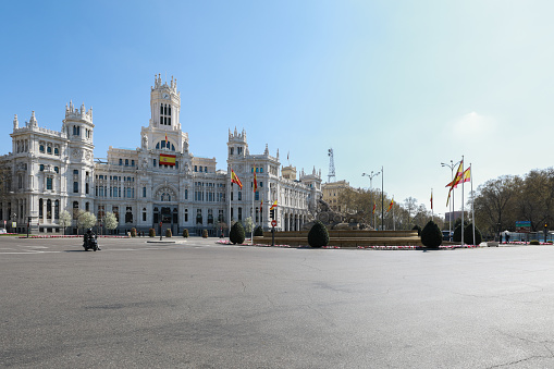 This picture was taken at The Plaza de Cibeles where is sited the Town Hall of Madrid. On a usual saturday the square is full of tourist and people around, while now on March 14th It is absolutely empty due to the lockdown for coronavirus in Madrid