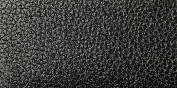 istock Background texture of black natural leather grain 1213719509