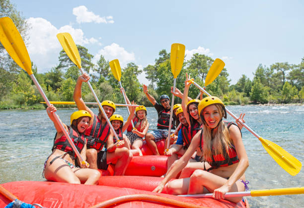 istock Group of people white water rafting 1213719732