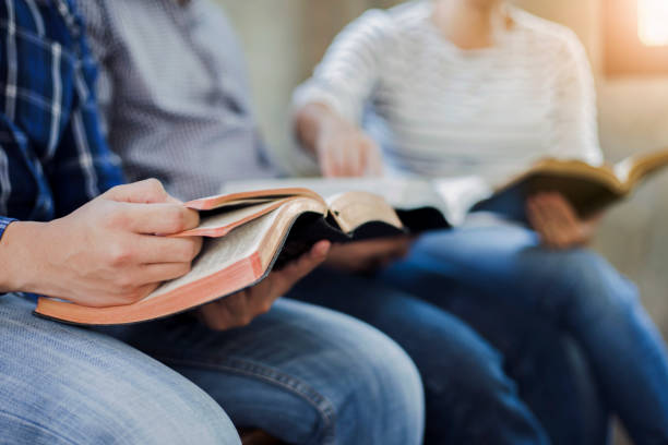 istock Christian friends group reading and study the bible together 1213722740