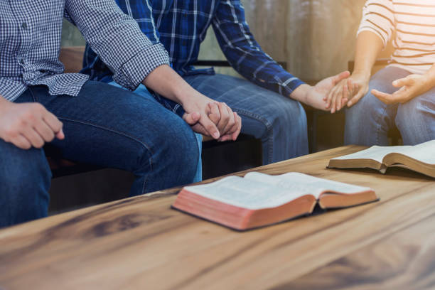 istock A Christian group holding hands and pray together 1213722802