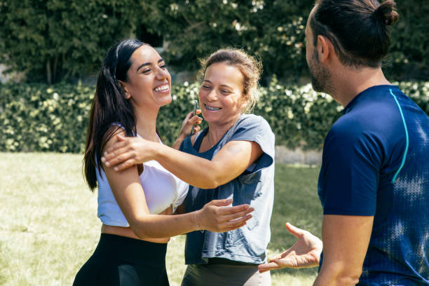 istock Friends greeting each other outdoor 1213724193