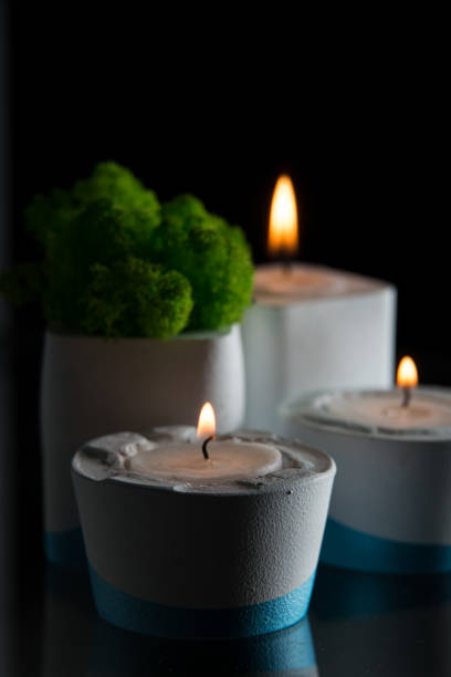 istock candles and moss in white and blue concrete candle holders 1213725120