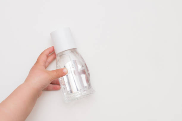 istock Hand antiseptic gel bottle in child