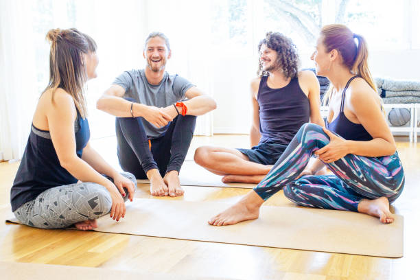 istock Cheerful young people in yoga studio 1213728388