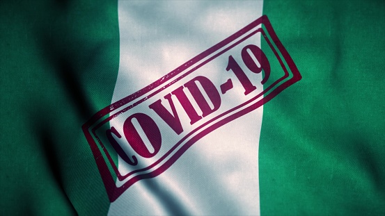 Covid-19 stamp on the national flag of Nigeria. Coronavirus concept. 3d illustration.