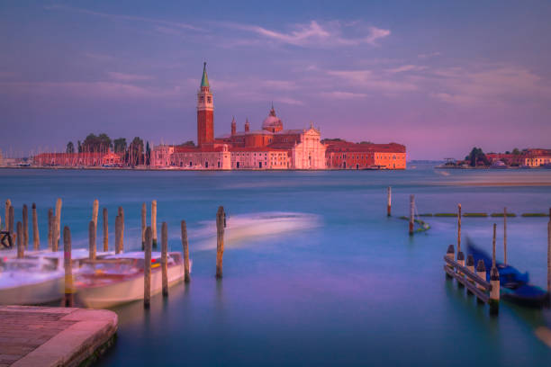 Long exposure: ethereal San Giorgio Maggiore cathedral at sunset - Venice, Italy Long exposure: blurred ethereal San Giorgio Maggiore cathedral at sunset - Venice, Italy venice italy grand canal honeymoon gondola stock pictures, royalty-free photos & images