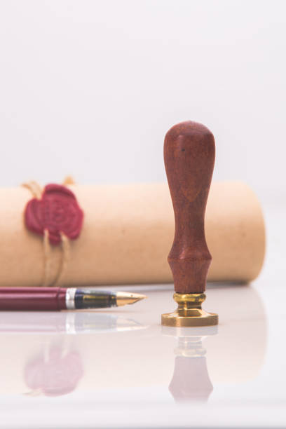 Fountain pen and old notarial wax seal on Fountain pen and old notarial wax seal on document shorthand stock pictures, royalty-free photos & images
