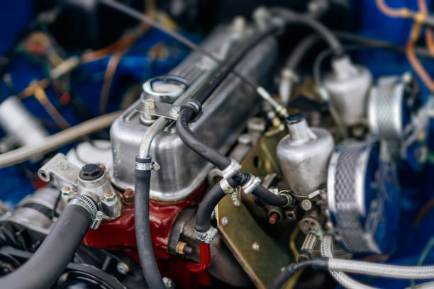 Velden, Austria - August 30, 2025: Vintage engine parts display intricate brass craftsmanship at an Oldtimer Festival, highlighting the beauty of classic automobiles and engineering