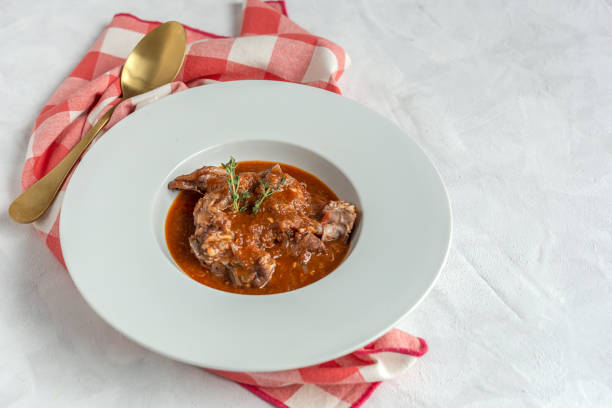 istock Lamb stew with aromatic herbs seen from above 1213736824