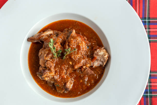 istock Lamb stew with aromatic herbs seen from above 1213736831
