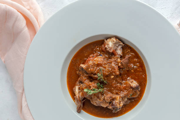 istock Lamb stew with aromatic herbs seen from above 1213736838