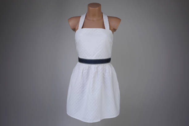 istock White elegant sundress on a mannequin on a gray background 1213737629
