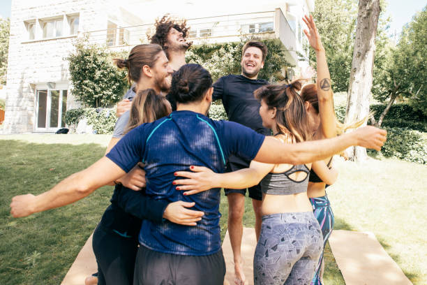 istock Happy young people hugging outdoor 1213737728