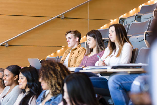 istock Group of attentive college students in lecture hall 1213739000