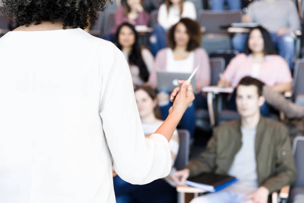istock Female professor makes a point during lecture 1213739020