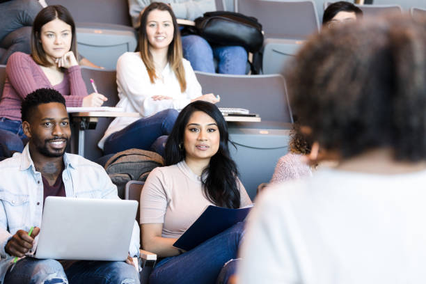istock Attentive students listening to professor 1213739024