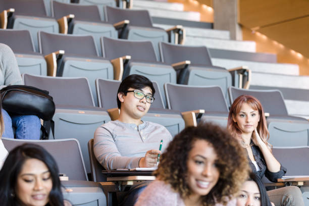 istock Male and female college student attending class 1213739040